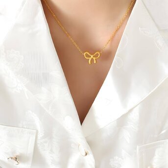 "Cherie Bow" Necklace 18k Gold-plated steel.